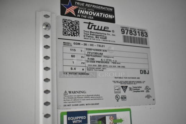 Label on a 2019 True GDM-26-HC Commercial Single Door Reach In Cooler. Shows model, voltage, refrigerant, and warnings.