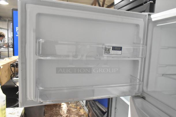 Brand new Frigidaire FFTR2045VWD cooler with freezer, scratch and dent, 115V, interior shelves shown, QR code tag visible.