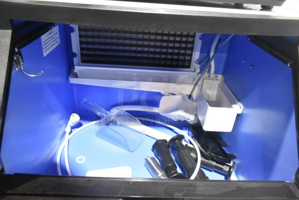 Brand new Avantco 194UCF280A ice machine, undercounter model, full cube, 299 lb. capacity, visible components inside.