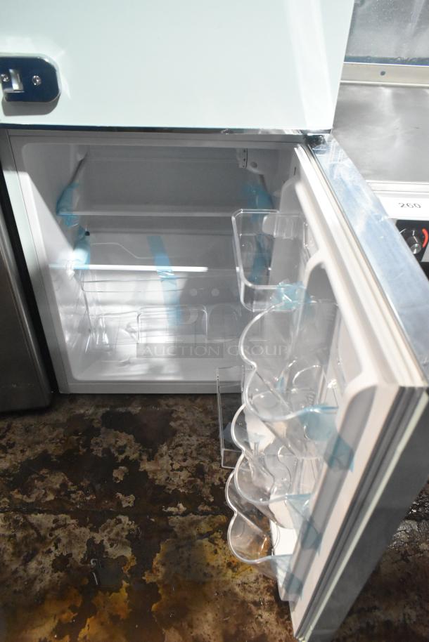 Frigidaire EFR840-MINT-6COM mini cooler with freezer, 115 volts, 1 phase. Clean interior with multiple shelves.