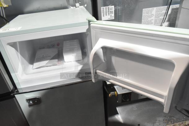 Frigidaire EFR840-MINT-6COM mini cooler with freezer, white interior, visible manual. 115 volts, 1 phase. Mint condition.