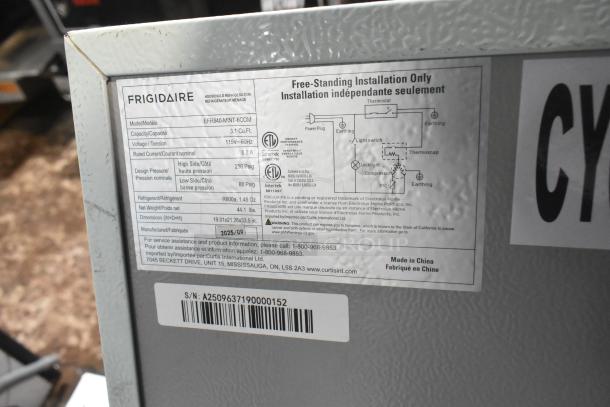 Frigidaire EFR840-MINT-6COM Mini Cooler with Freezer, 115V, 1 Phase. Label shows specs: 3.1 Cu. Ft., R600a refrigerant.