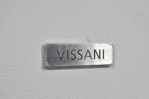 Vissani MDTF14WH5 cooler/freezer nameplate on textured surface, showcasing brand marking.