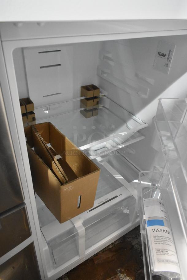 Vissani MDTF14WH5 Cooler with Freezer, 115 volts, 1 phase. Features clear shelving and storage bins. Includes Vissani info label.