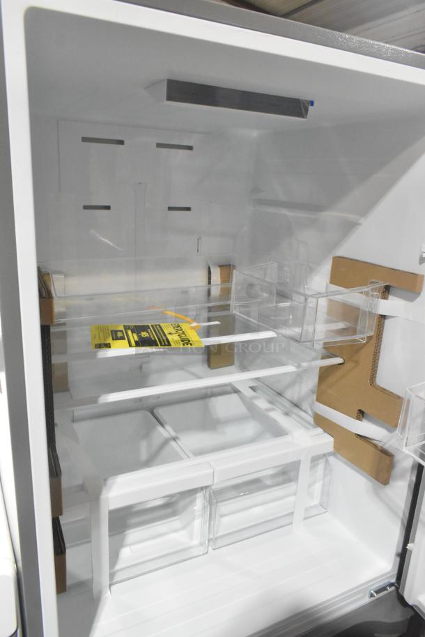 Reach-in cooler with freezer drawer, 115 volts, 1 phase. Features multiple shelves and compartments. Mint condition.