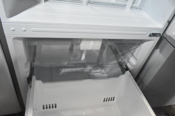 Reach-in cooler with freezer drawer, 115 volts, 1 phase, pristine condition, interior view with open drawer.