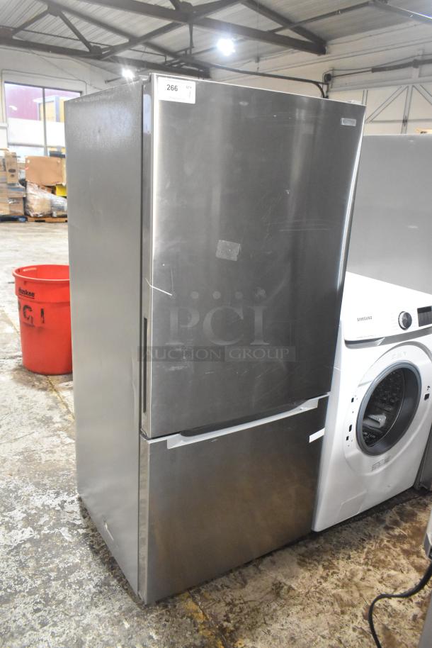 Stainless steel reach-in cooler with freezer drawer, 115 volts, 1 phase. Minor surface scratches, tag indicates item 266.