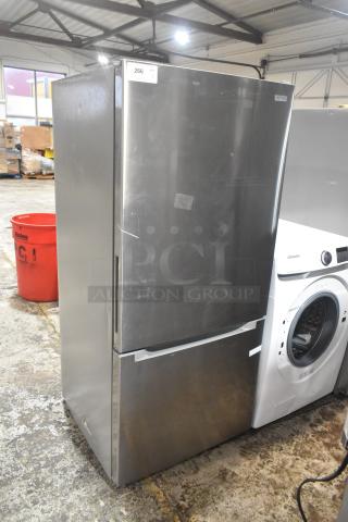 Stainless steel reach-in cooler with freezer drawer, 115 volts, 1 phase. Minor surface scratches, tag indicates item 266.