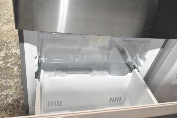 Reach In Cooler with freezer drawer, stainless steel finish, 115 volts, 1 phase, clean interior, excellent condition.