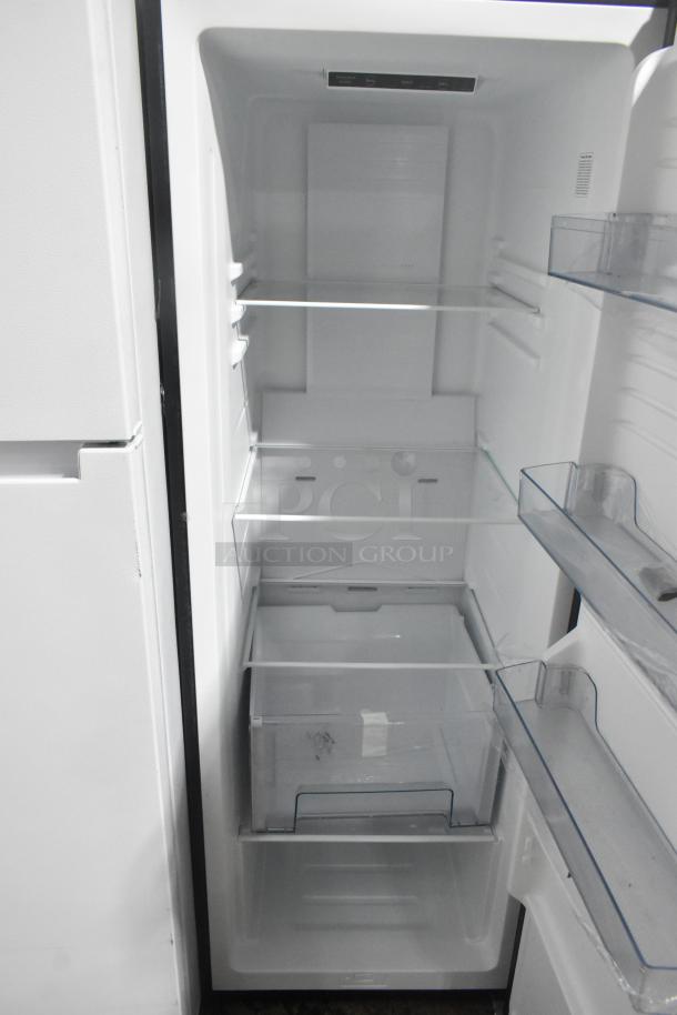 Vissani Reach In Cooler, 115 volts, 1 phase. Features adjustable shelves and clear door bins. Clean interior, well-maintained.