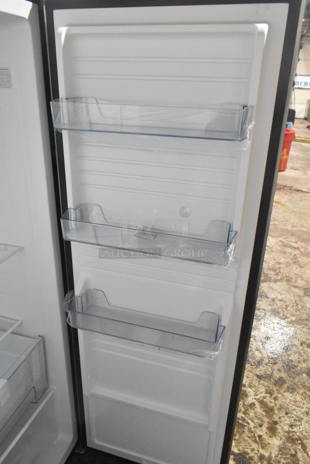 Vissani reach-in cooler with three door shelves, 115 volts, 1 phase, in excellent condition.