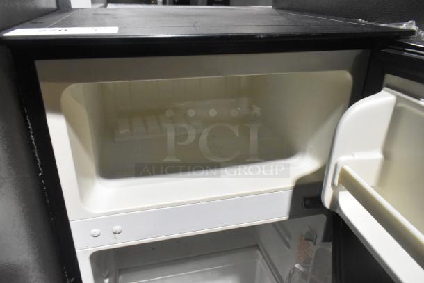 Magic Chef HMDR310SE Mini Cooler with Freezer, black, interior view. Model: HMDR310SE, 115 volts, 1 phase, clean condition.