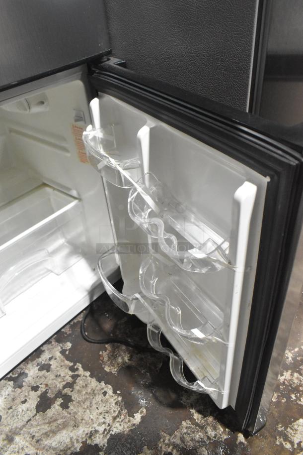 Magic Chef HMDR310SE mini cooler with freezer, white interior, door racks, 115V, 1 phase, visible cord, good condition.