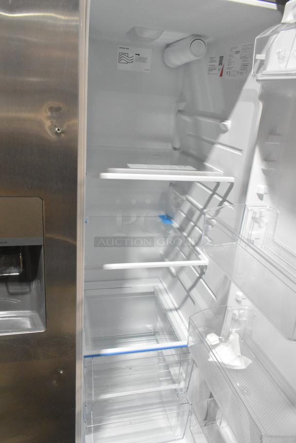 Frigidaire FRSS2628ASN cooler/freezer with ice/water dispenser, interior view, shelves and door compartments visible. 115V, 1 Phase.