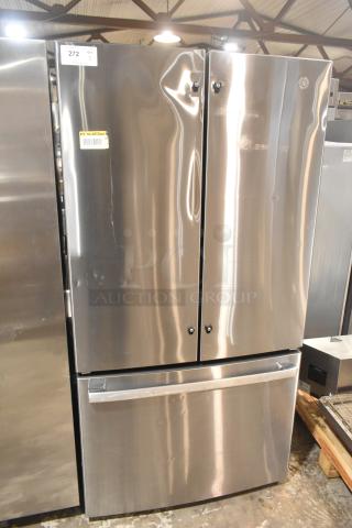 GE GNE27JYMYFFS refrigerator with freezer drawer, stainless steel finish, minor surface dents, label shows 115V, 1 Phase.