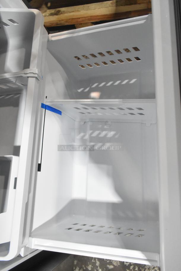 GE GNE27JYMYFFS reach-in cooler with freezer drawer, 115V, 1 Phase. Interior shelving visible, new condition.