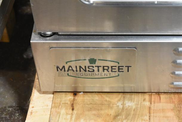 MainStreet Equipment CG1-N convection oven, natural gas, brand new condition, view through doors, 54,000 BTU, label shown.