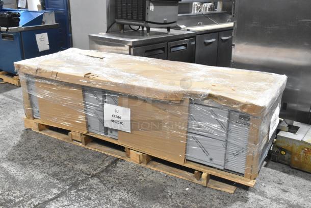 Brand new 2023 Hoshizaki CR98A commercial 4 drawer chef base, scratch and dent condition, in packaging on a pallet. Tags indicate model CR98A.