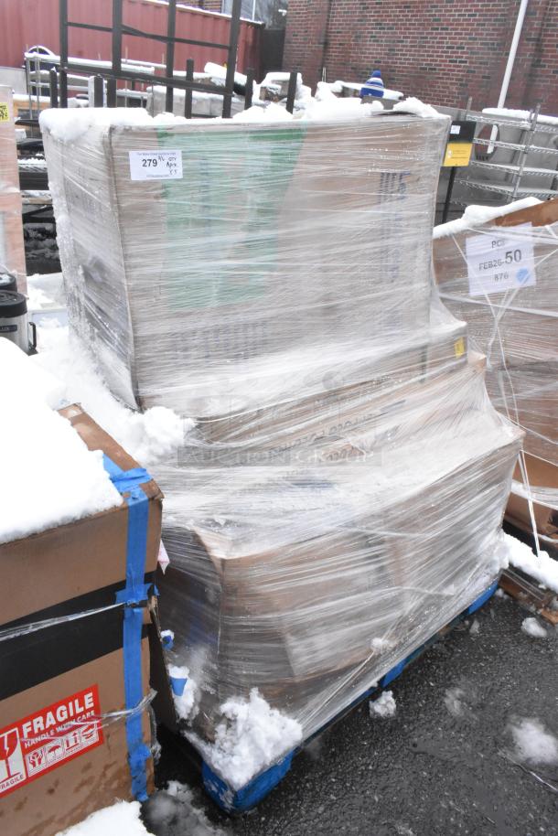 Shrink-wrapped pallet with mixed items including a bi-folding table and side chair, labeled "Fragile" with some snow.