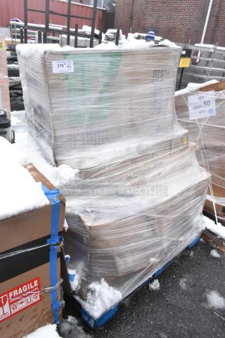 Shrink-wrapped pallet with mixed items including a bi-folding table and side chair, labeled "Fragile" with some snow.