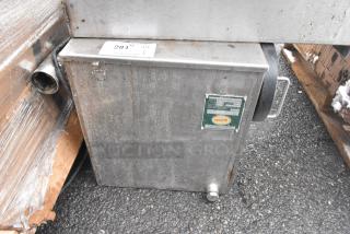 Environmental GGX-25 grease trap, 50 lb capacity, used condition. Features metal casing, inlet/outlet pipes, and manufacturer label.