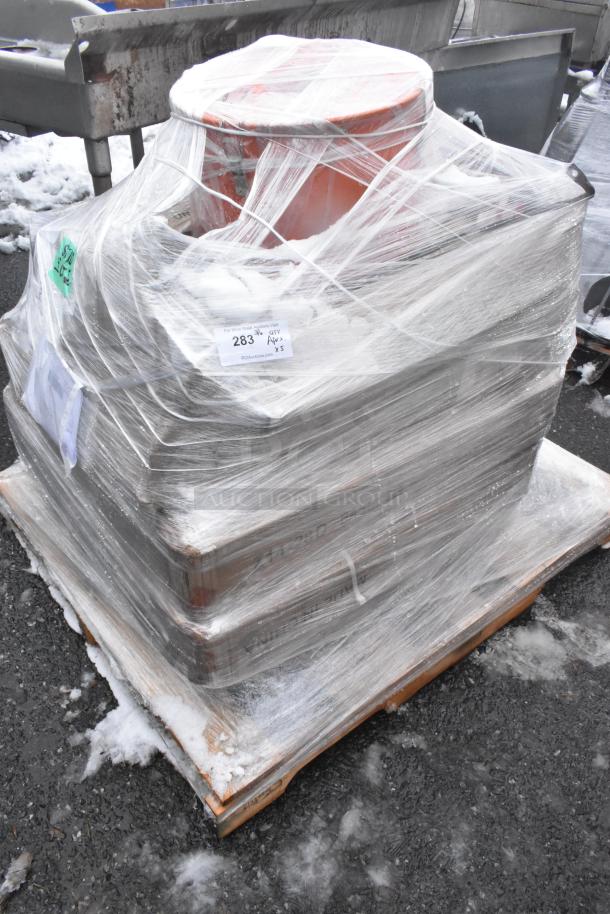 Shrink-wrapped pallet with 5 new scratch and dent items including a fillet table and oil pail. Label indicates auction lot 283.