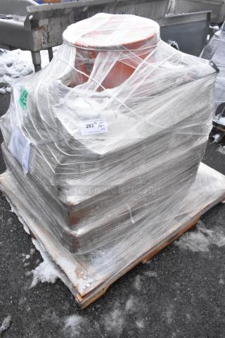 Shrink-wrapped pallet with 5 new scratch and dent items including a fillet table and oil pail. Label indicates auction lot 283.