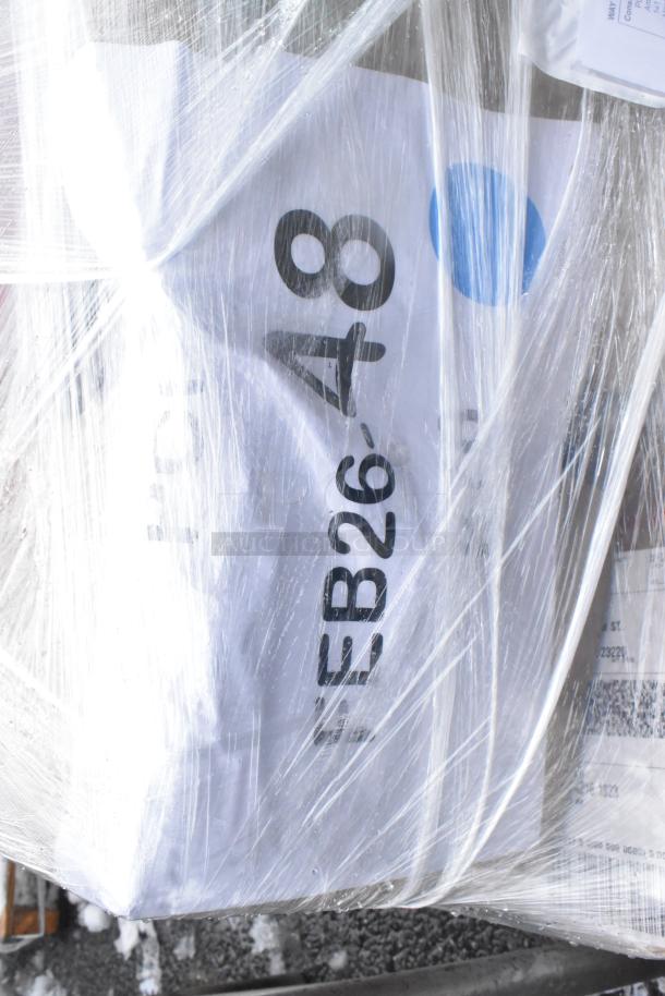 Wrapped auction lot containing five items, including a fillet table and oil pail. Label reads "EB26-48." Brand new, scratch and dent condition.