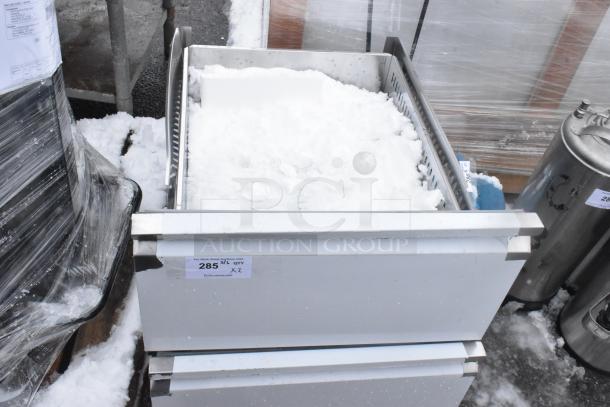 Brand new scratch and dent metal drawers, two units. Label indicates auction item number 285.