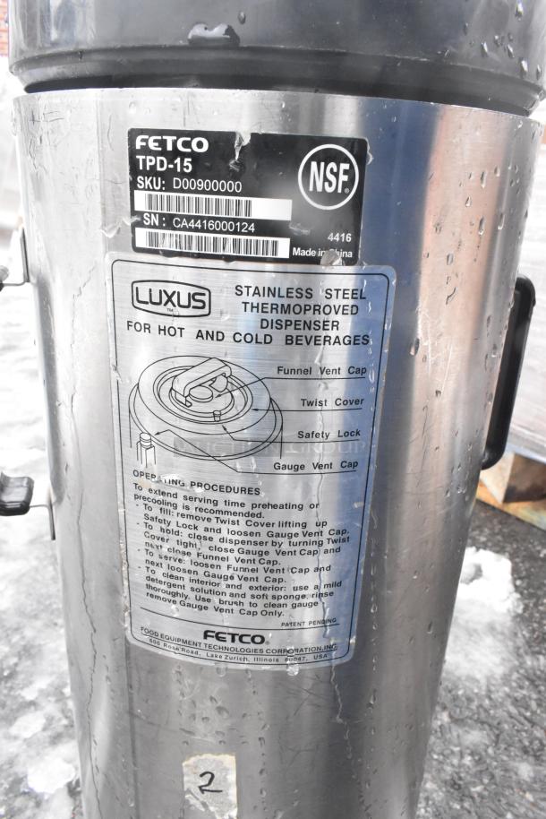 Fetco Luxus TPD-15 beverage dispenser, stainless steel, NSF certified, used condition. Label shows operating instructions.