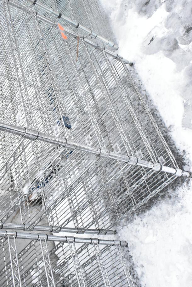 Chrome finish 10-tier wire shelving unit in snow, excellent condition, dismantling required by buyer. Consider freight charges.