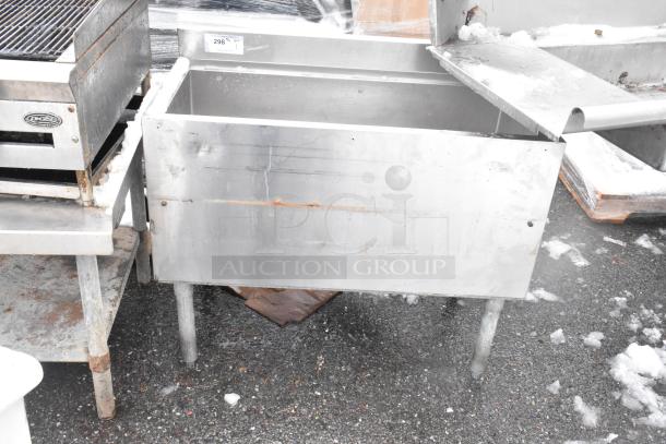 Commercial ice bin, stainless steel, visible rust and wear, open lid, exterior label reads "298". Suitable for commercial use.