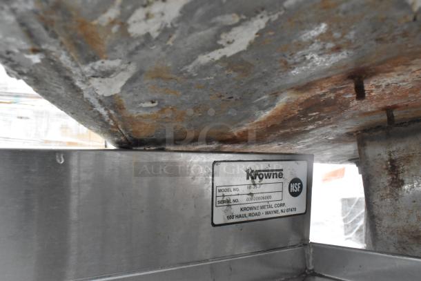 Krowne commercial ice bin, model 18-35-7, shows visible rust and wear. NSF certified. Serial number 30300306009.