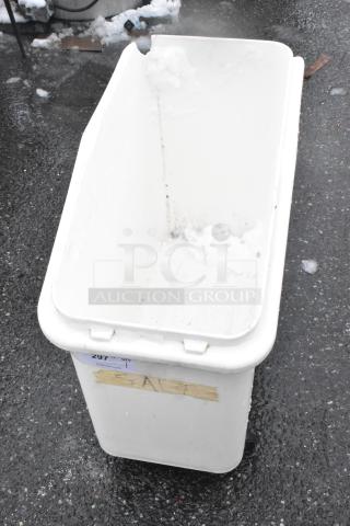 White poly ingredient bin on commercial casters, visible wear, auction tag labeled "297" and tape marked "SALT."