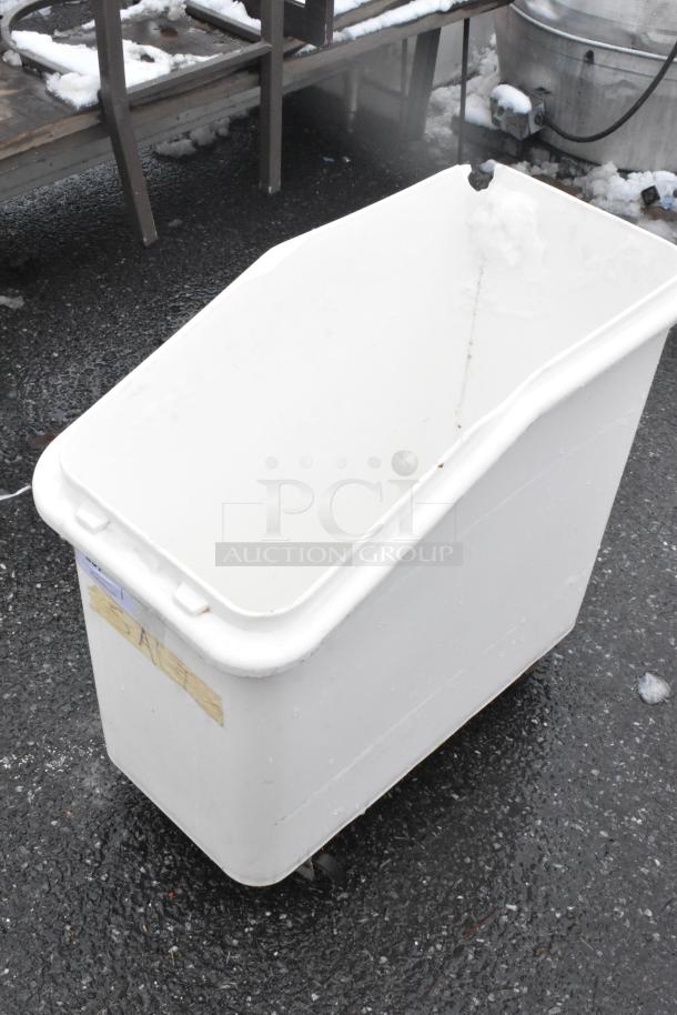 White poly ingredient bin with commercial casters, used condition. No visible labels or markings. Ideal for storage.