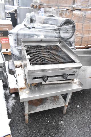 Commercial countertop charbroiler grill on equipment stand, stainless steel, dual controls, pre-owned condition with visible wear.