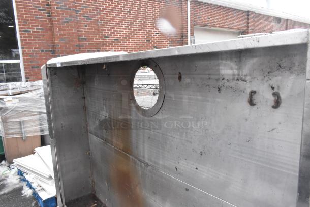 7.5' commercial steam hood, metal construction, visible wear and rust, with mounting hooks and exhaust opening.
