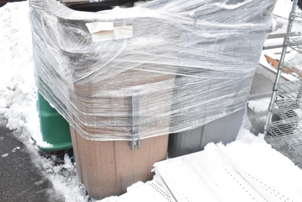 Wrapped set of 6 items including a Regency EG-2436 wire shelf and poly trash bins, stored outdoors in snowy conditions.