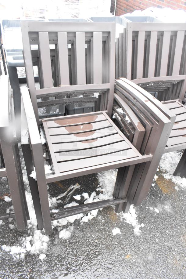 26 brown outdoor arm chairs, slatted design, stacking, durable metal, light snow, excellent condition. Auction lot size 26.