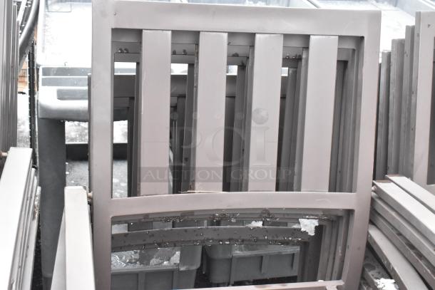 26 brown outdoor arm chairs, sturdy construction, used condition. Auction lot offers 26 times your bid.