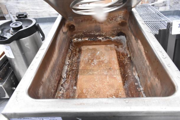 APW Wyott CW-2A countertop food warmer with visible signs of rust and residue, 120 volts, 1 phase, stainless steel exterior.