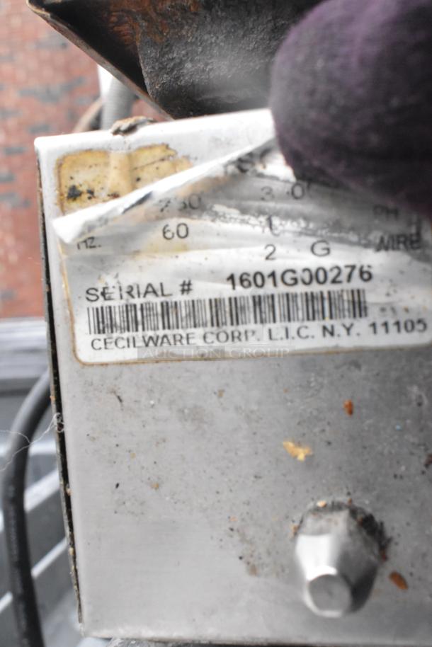 Cecilware countertop double panini press, serial #1601G00276, shows wear on label. Model features durable construction.