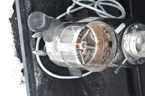 Mazzer Luigi Mini Timer espresso bean grinder base, 120 volts, 1 phase, showing wear. Labels indicate voltage and safety warnings.