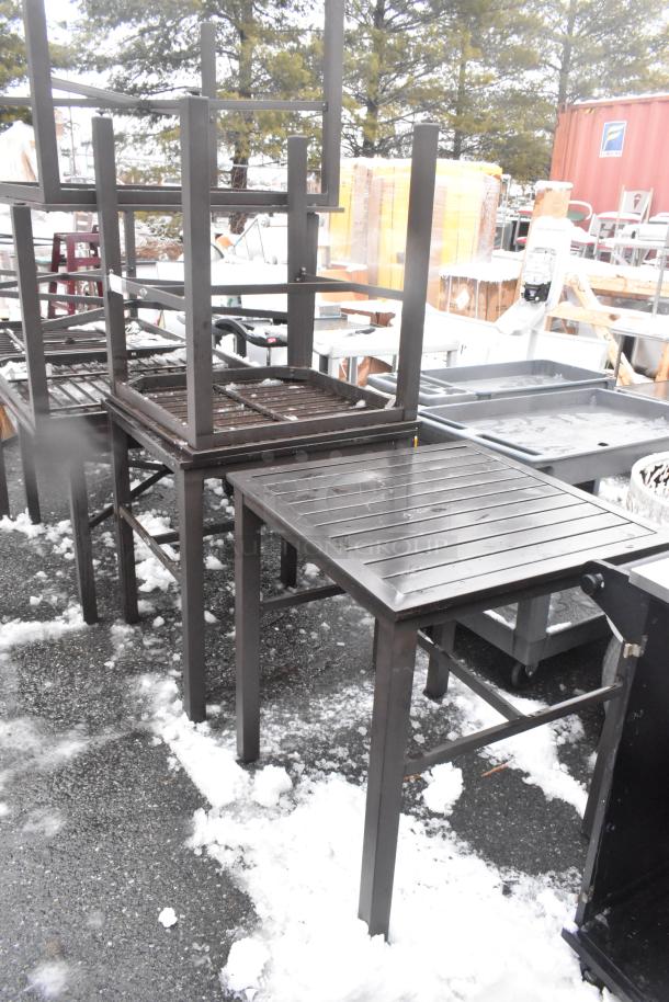 Three brown outdoor patio tables stacked, metal construction, weather-resistant, used condition, sell for 3 times your bid.
