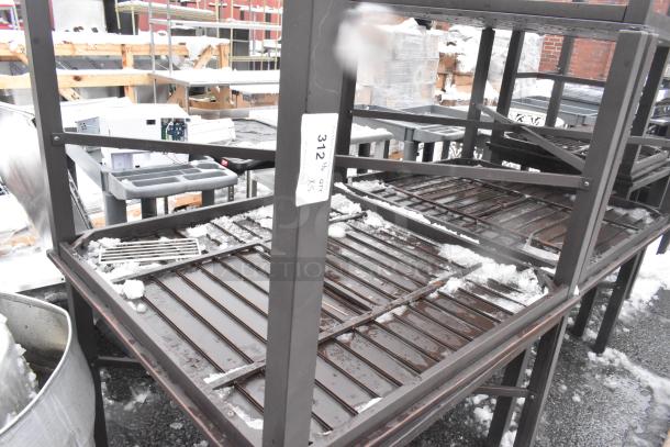 Set of 5 brown outdoor patio tables, metal frames, stackable condition, snow-covered, visible lot tag "312 X5".
