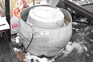 Mushroom rooftop exhaust fan, metal finish, visible wear, placed on a snowy surface. Auction tag 313 attached.