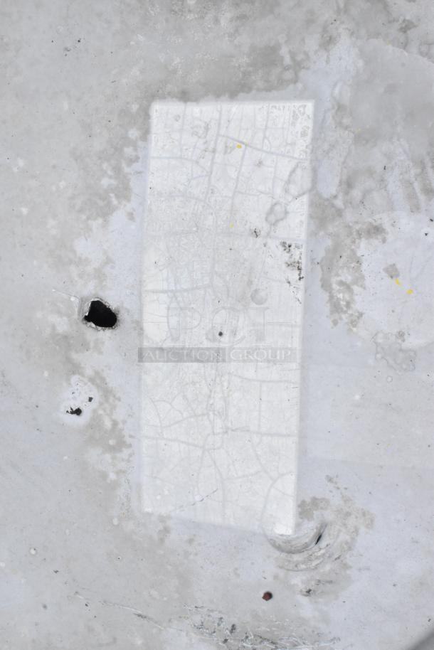 Mushroom rooftop exhaust fan, metal construction, visible wear and stains, ideal for ventilation systems.