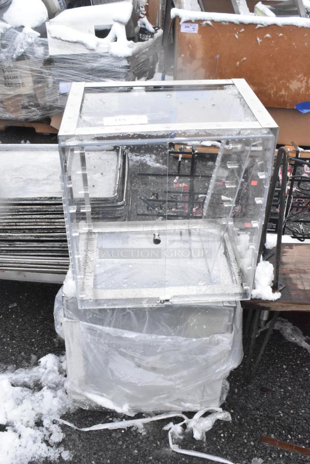 Two clear poly countertop cookie merchandisers, durable acrylic, hinged doors, good condition, ideal for displays.