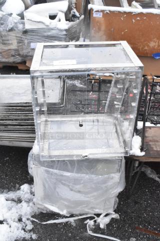 Two clear poly countertop cookie merchandisers, durable acrylic, hinged doors, good condition, ideal for displays.