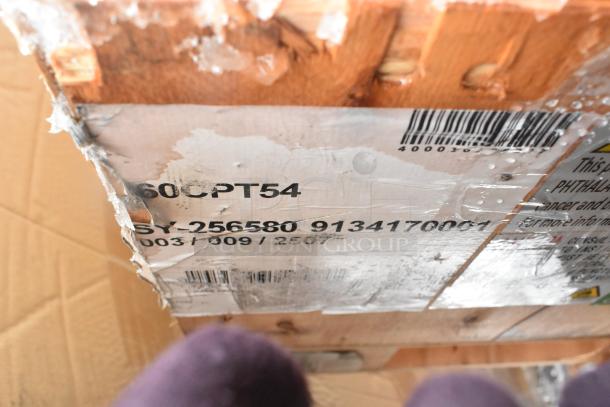 Pallet with new scratch and dent items including shelves and tabletop, label shows "60CPT54" and barcode.